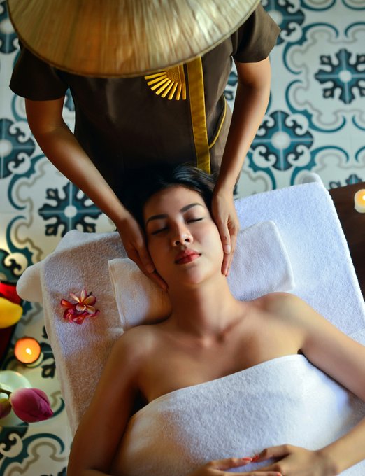 Woman in black tube top sitting on chair